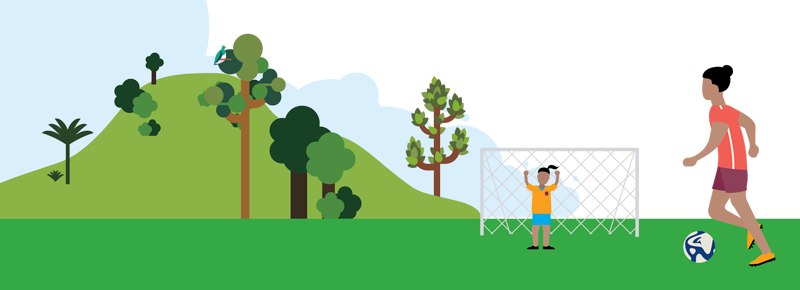 Illustration of a sports field with a child near a football goal while an adult approaches, kicking a football towards the goal. A hill and trees are in the background.
